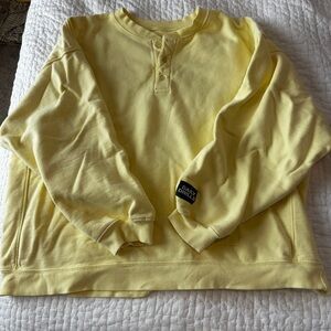 Daily Drills Woman’s Yellow Fleece Henley Sweatshirt